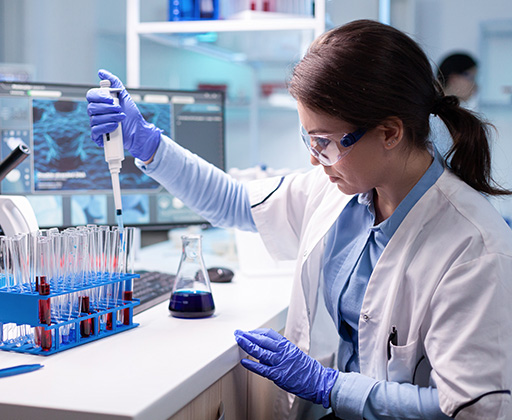 A scientist in a laboratory testing chemicals
